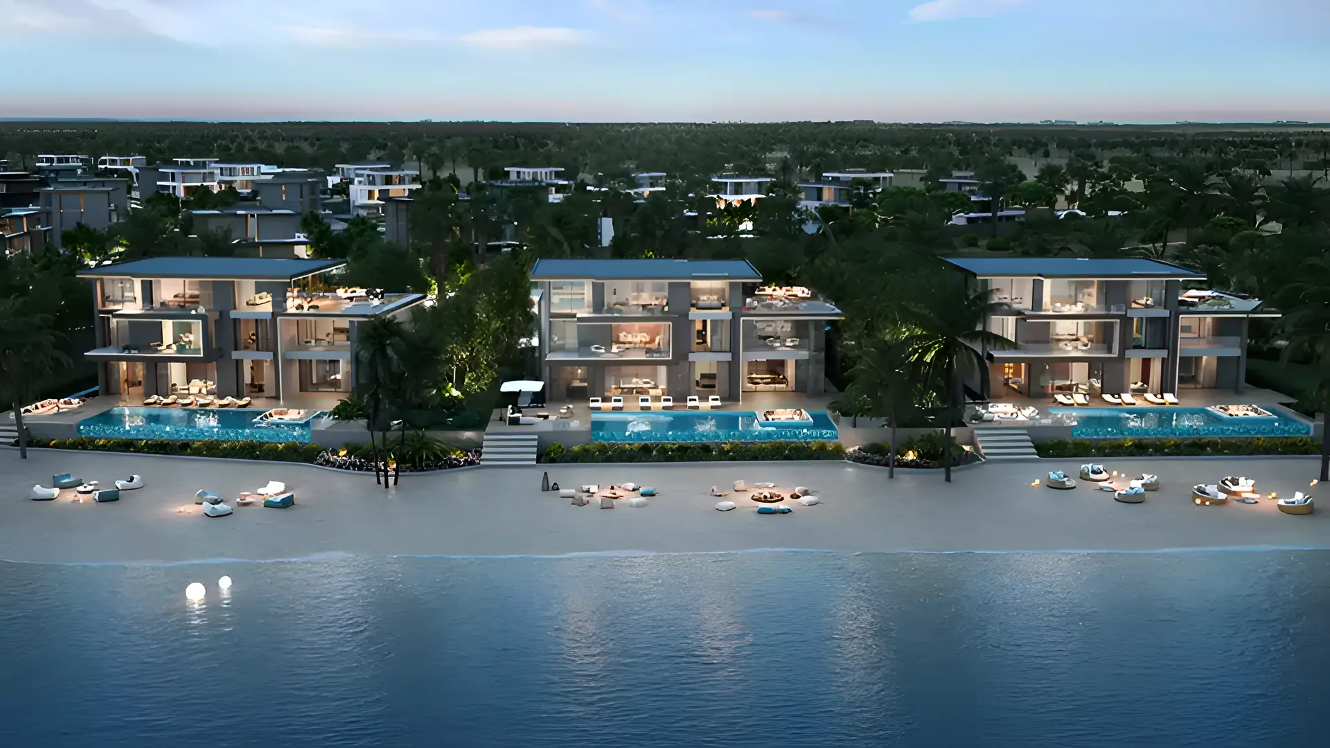 Beachfront mansions at Jacob & Co. Beachfront Living at dusk