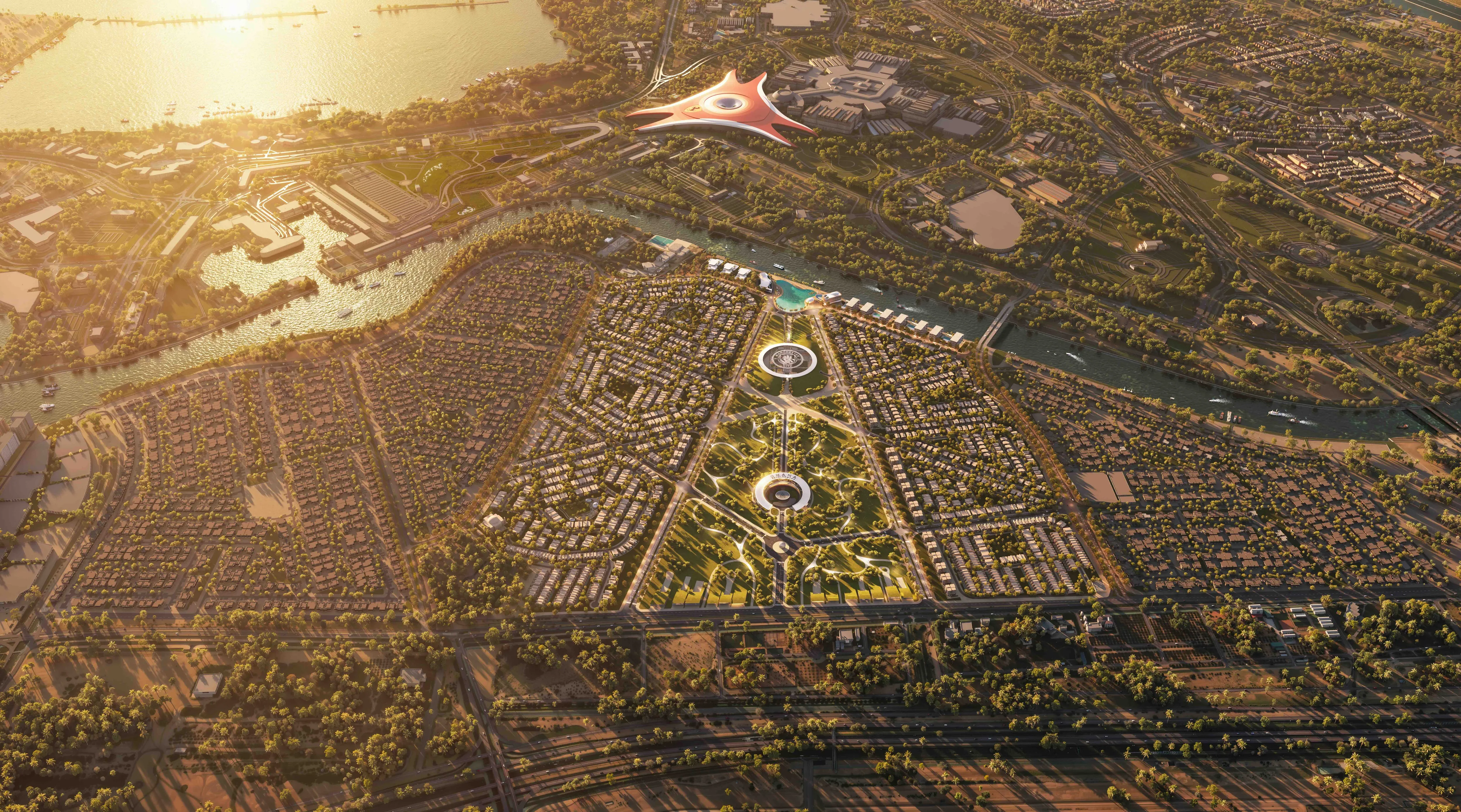 Aerial view of Manchester City Yas Residences by Ohana at golden hour, with Yas Island beyond the canal